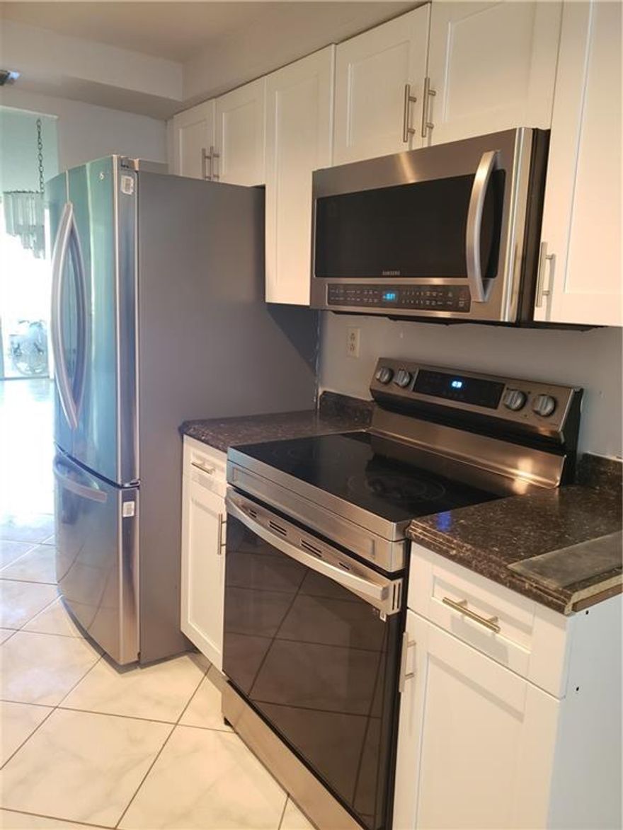 REDUCED FOR QUICK SALE!!!First-floor unit overlooking the pool area. New kitchen with new appliances and freshly painted. 2nd bathroom is completely updated.A/C and water heater less than 2 years old. Budget, application, and part 1 of condo docs attached. Part 2 is too big to upload - will email upon request/executed contract