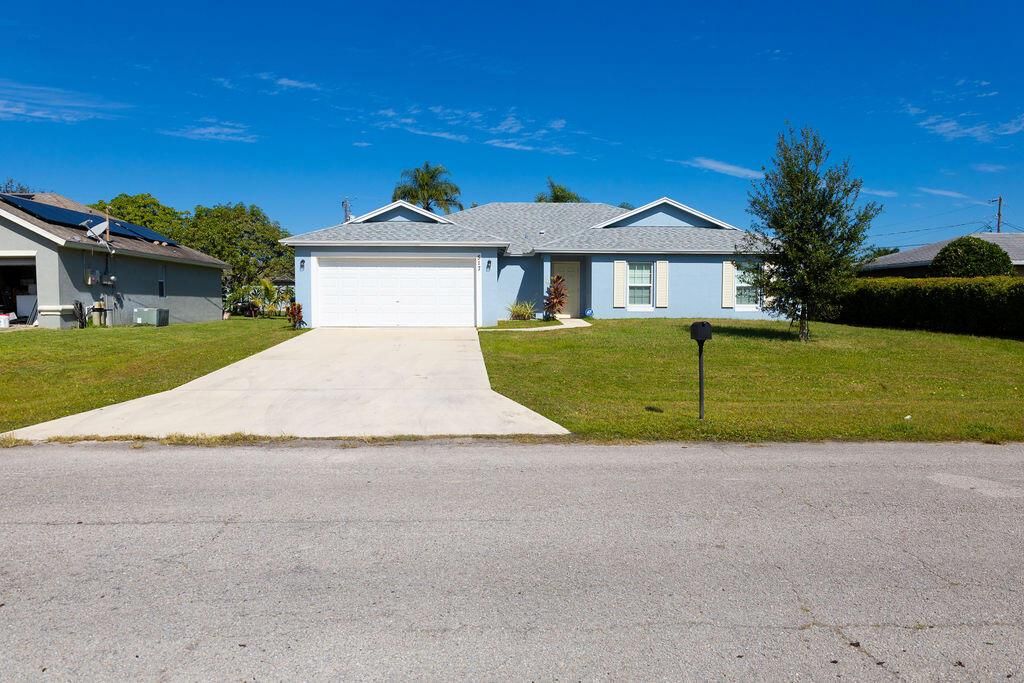 Photo of 517 SW Ray Avenue, Port Saint Lucie, FL 34983 (MLS # R11138314)