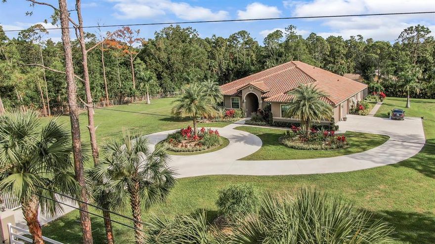 Stunning custom home on 2.5 acre estate. Country living at its finest, with nothing left to be desired. Starting with a chef's  kitchen to die for, Thermador 48'' gas stove with double oven, 54'' Thermador built in Refrigerator/Freezer. There are custom granite tops throughout, built in Miele coffee station, 1000 gallon propane tank, full house generator, tankless gas water heater, master bedroom has built in coffee station and refrigerator, an enormous 14x21 walk-in closet with granite covered island, his/her walk behind shower with electronic controlled faucets. Magnificent custom brazilian wood front double door, oversize 4+ car garage with additional room for storage. Every closet in the house has custom built shelves along with the custom built den which has gorgeous marble desktop. Every bedroom has its own full bath with a walk-in closet. Plantation shutters throughout on top of the custom impact glass windows. Now we get to the outside oasis, with huge oversize lanai, custom pavers, outside kitchen with granite top. There is a beautiful built in pool with hot tub and oversize sunshelf, entirely screened in for your enjoyment. Plenty of room for a horse stable in fully fenced yard with electric gate at entrance, all with no HOA. Bring your pickiest clients, they won't be disappointed.