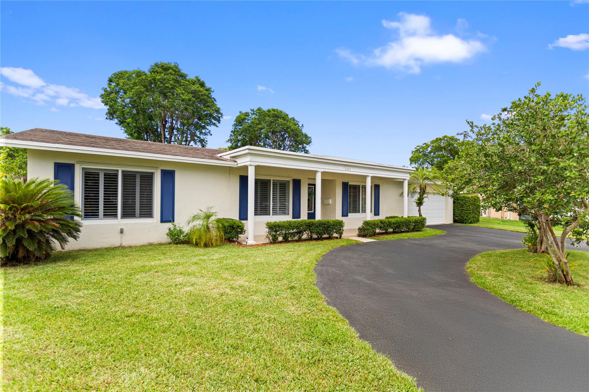 Beautifully renovated 5BR/3BA, OPEN CONCEPT home boasting over 3000 total sqft on a quiet cul-de-sac lot that is roughly 1/2 ACRE. Stunning oversized kitchen with a massive center island, separate full size refrigerator/freezer combo, LG double ovens, pot filler, JennAir extractor, induction cook top and a farmhouse sink with a window overlooking the pool and yard. UPDATED ELECTRICAL PANEL, 2019 A/C, 2018 water heater, 2015 flat roof, 2005 shingle roof, FULL IMPACT WINDOWS AND DOORS. Laminate wood floors throughout, NEW carpet in two bedrooms. Double master suites—perfect for IN-LAWs or guests. Impact sliders retract all the way open to a spacious 34x15 covered patio. The canal connects to Fig Tree lake and park. Circular driveway, great closet space, amazing park-like backyard setting.