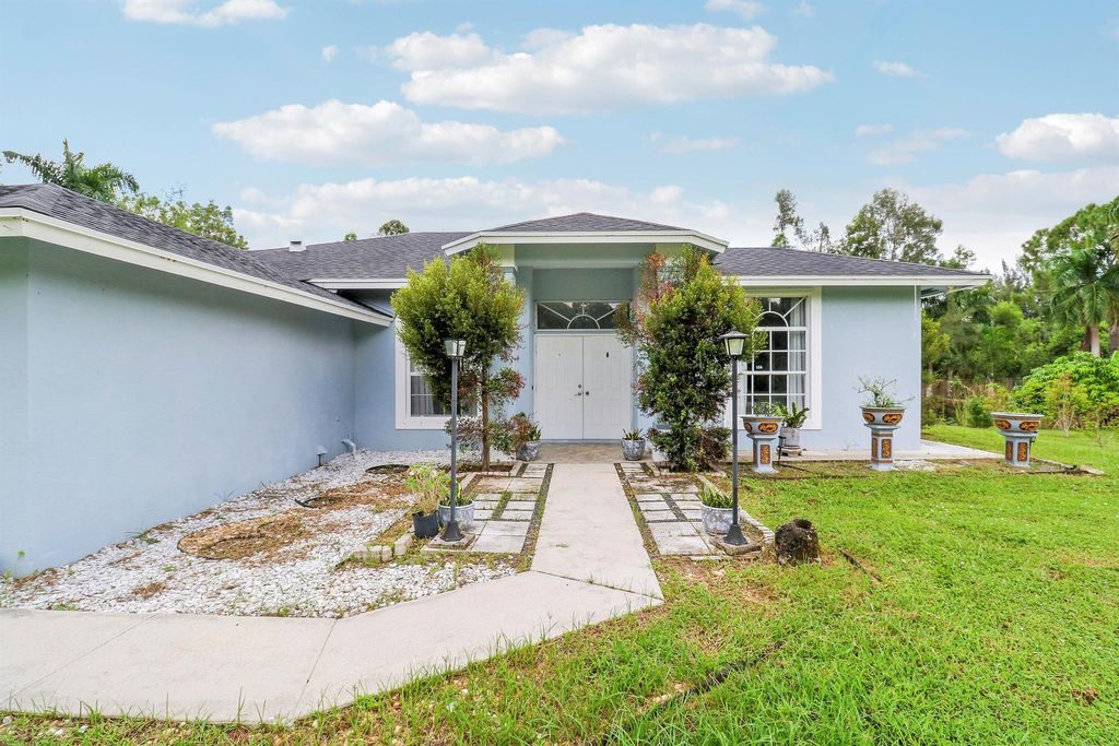 Photo of 15820 92nd Court N, West Palm Beach, FL 33412 (MLS # R11124650)