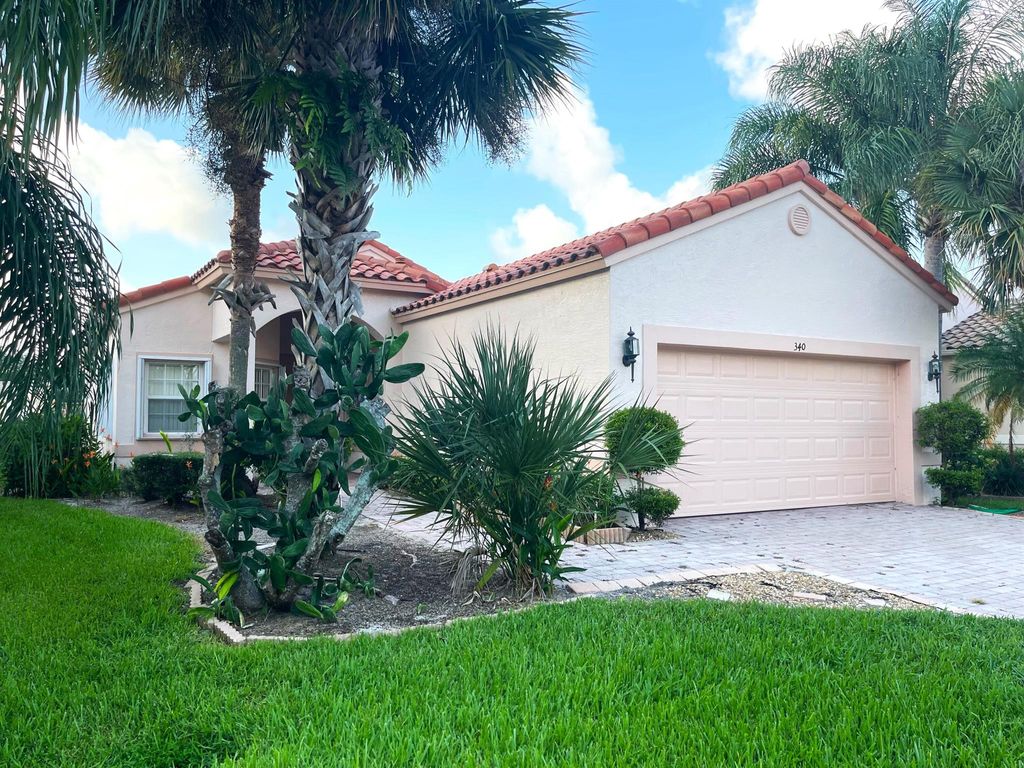 Photo of 340 NW Breezy Point Loop, Port Saint Lucie, FL 34986 (MLS # R11007804)