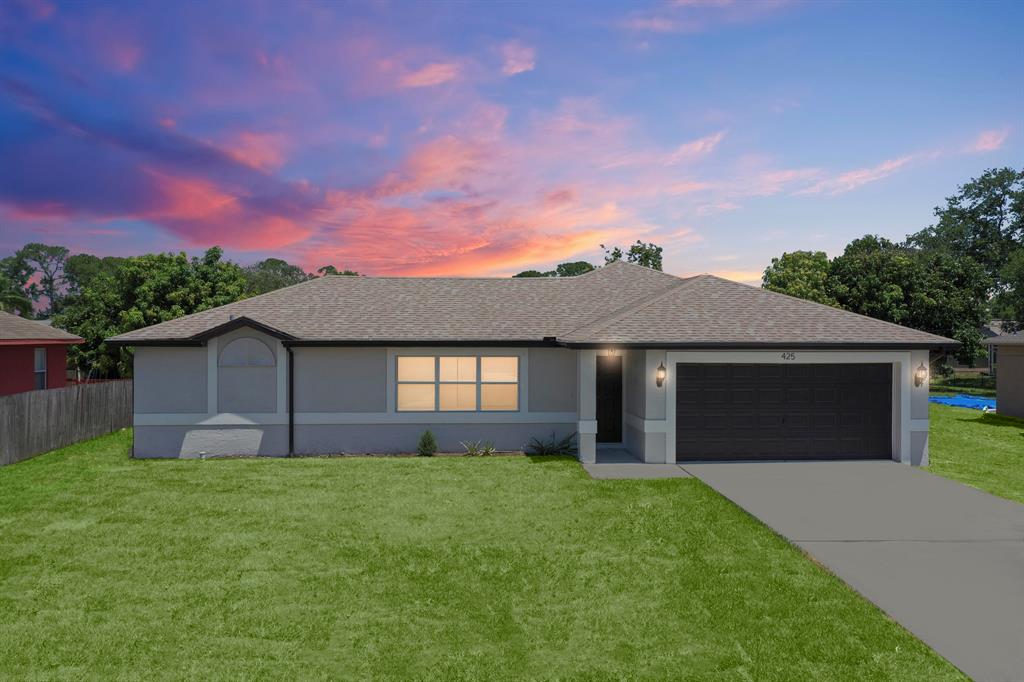 Welcome to this charming 3-bedroom, 2-bathroom home located central Port St. Lucie. This recently updated residence features CBS construction, a spacious 1,400 sqft interior living space, 2-car garage, covered back patio, beautiful tile floors throughout for easy maintenance and a modern aesthetic. New roof in 2017, New AC and WH in 2017. Freshly painted interior and exterior 2023. The open concept layout and split bedroom configuration create a comfortable flow between the living, dining, and kitchen areas. The three bedrooms provide private retreats, with the master bedroom offering an en-suite bathroom for added convenience. Deals like this one don't come along often these days. Call today to schedule a tour.