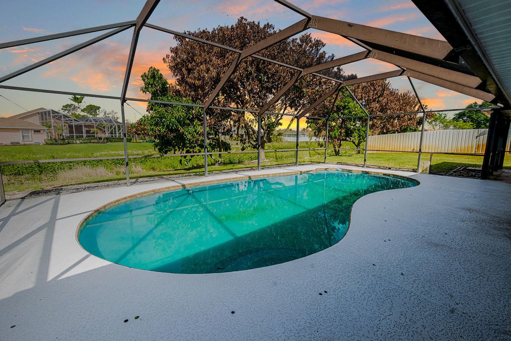 Photo of 5400 NW Emblem Street, Port Saint Lucie, FL 34983 (MLS # B26016125)