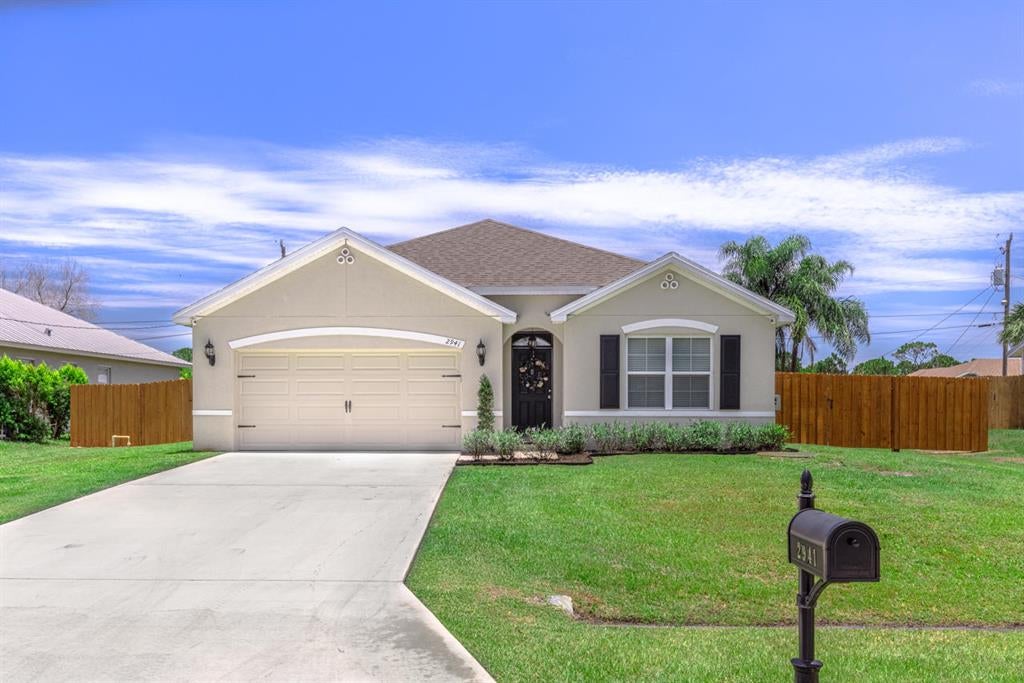 Photo of 2941 SW Bright Street, Port Saint Lucie, FL 34953 (MLS # R10723861)