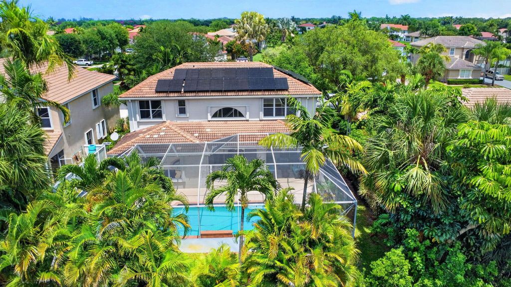 Photo of 6283 Shadow Tree Lane, Lake Worth, FL 33463 (MLS # B26029537)