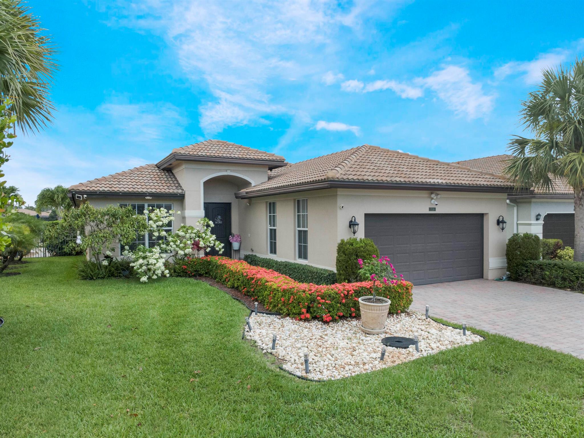 Welcome to effortless sophistication in this immaculate 3 bedroom + flex room, 2-bath dream home. Nestled on a tranquil lakefront, your private oasis awaits--complete with a heated saltwater pool, soothing fountain, and gorgeous travertine tile that flows to a covered patio with remote hurricane screen. Inside, the split floor plan is dressed to impress with vinyl planks and porcelain tile. The kitchen gleams with stainless steel appliances, Quartzite countertops, and an oversized pantry. Wake up to water views in the bay-windowed primary suite featuring dual closets and a spa-worthy en-suite bath with seamless glass shower and marble tile. Upgrades? You've got them, from a Generac whole house generator (500-gal tank) to full impact windows. See additional remarks for more info.
