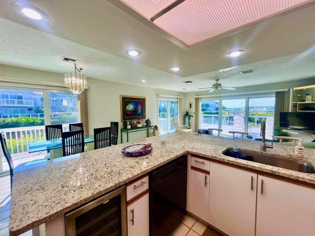 Photo of 2486 Harbour Cove Drive, Hutchinson Island, FL 34949 (MLS # B26063941)