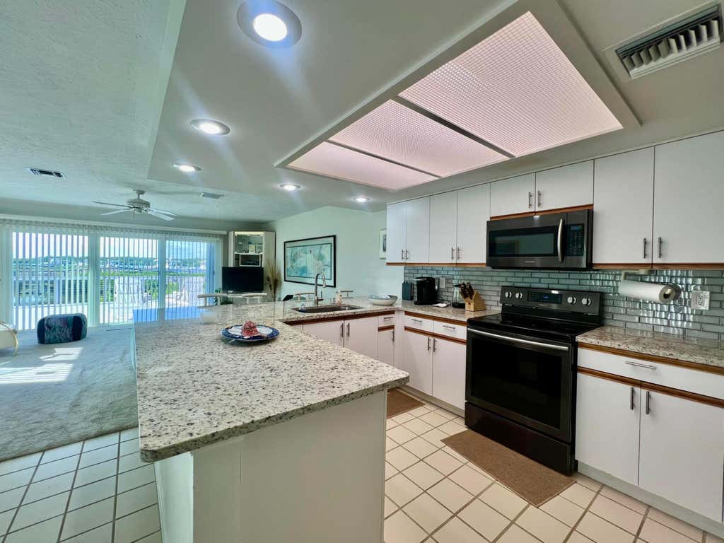 Photo of 2486 Harbour Cove Drive, Hutchinson Island, FL 34949 (MLS # B26063941)