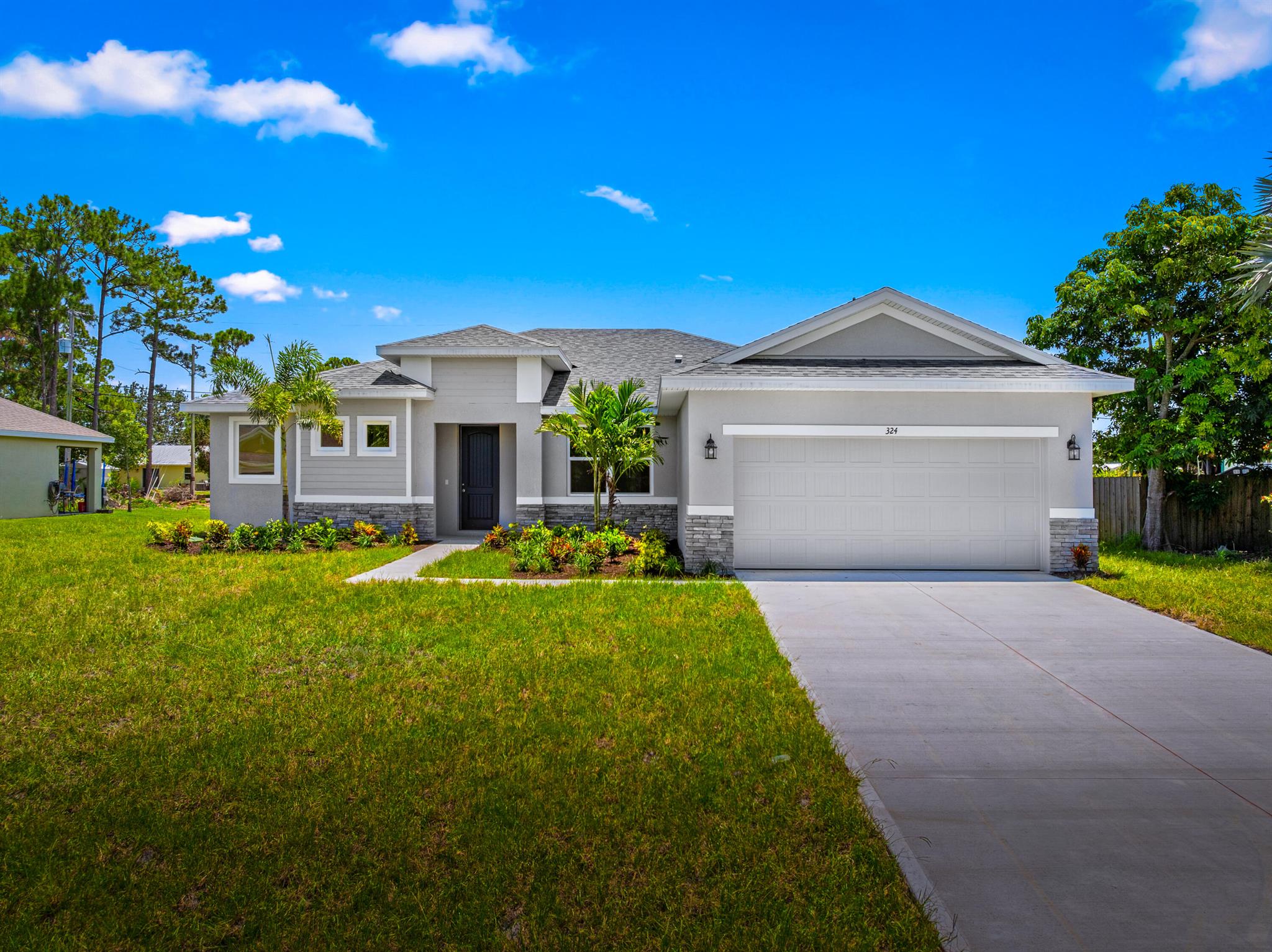Ready now waterfront 4 bedroom Custom Coastal Model. This home has an amazing view of the entire pond behind the home and is loaded with upgrades. This home includes impact windows, 8 foot doors, 42 inch white shaker cabinets with soft close doors and drawers, huge island with quartz countertops, plank tile throughout the home, oversized tile to the ceilings in the shower, master shower has a spa like feel with frameless glass. This home also features a tile backsplash in the kitchen, stainless steel appliances including the fridge, big baseboards, walk in closets, pantry and many more. This home is near Becker rd and has an amazing view. It is also completed and ready to move in and close!