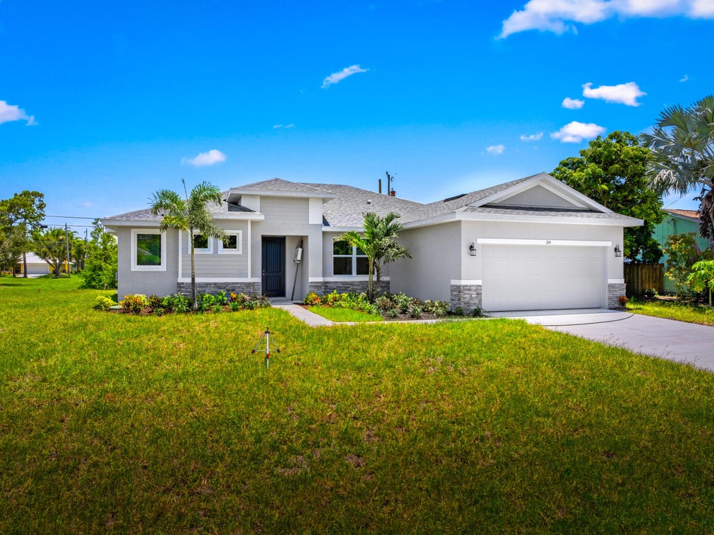 Photo of 324 SW Columbus Drive, Port Saint Lucie, FL 34953 (MLS # R11107884)