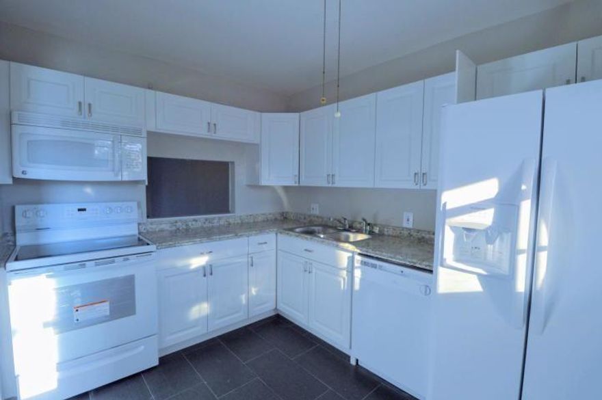 Stunning 2 bed/2 bath waterfront condo was recently painted inside and outside with laminate flooring and One year old appliances including an in unit washer/dryer and accordion shutters for hurricane protection. Additional storage is available middle of the building and space# 27. Brand New water heater and newly renovated bathroom. The community has a pool, gym and tennis courts. Enjoy a prime location in a quiet community. Minutes to downtown Delray Beach, Golf Courses, Restaurants, Shopping and Beaches. ***Water is included in the rent***