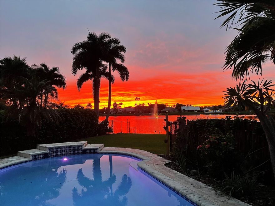 Spectacular family 3/2 home w/office/flex space in desirable OAK KNOLL of Pine Island Ridge.  Gorgeous, private pool area surrounded by 1/4 acre of tropical landscape.  Magical sunset water views from almost every room.  New wood-look floors, stunning chef's kitchen, elegant baths, summer kitchen on screened porch. Perfect house for entertaining.  Metal roof 2009, all openings have protection-impact /shutters.  Updated Elect w/generator interface. 2 car garage.  Solar hot water. Access to Pine Island Ridge Country Club w/golf (no equity membership!), jacuzzi, heated pool, tennis, fitness equipment, restaurants & nature trails. TOP A-rated schools.  Close to universities, shopping, 595, dining and beaches are 20 mins east. Oak Knoll is a well kept secret & these homes rarely come available.