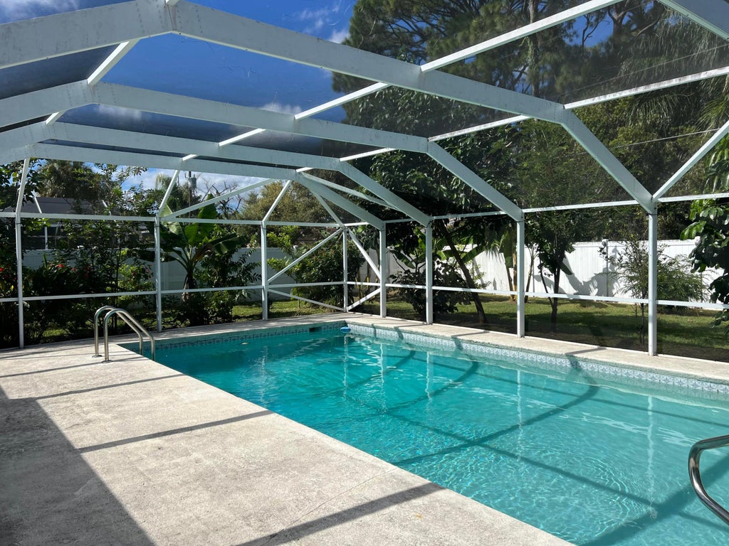 Photo of 557 NW Sherbrooke Avenue, Port Saint Lucie, FL 34983 (MLS # B26092784)
