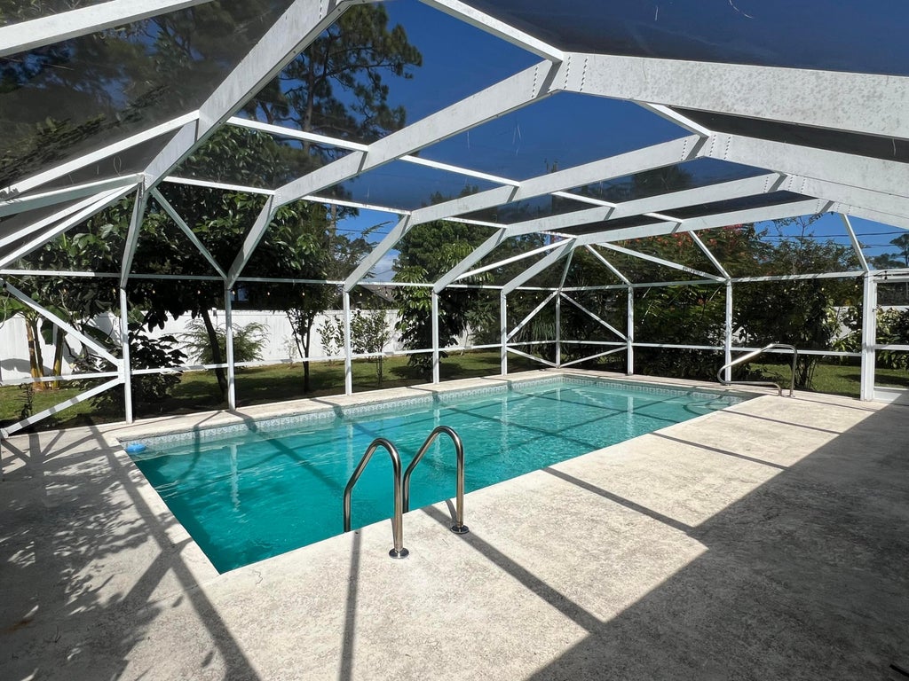Photo of 557 NW Sherbrooke Avenue, Port Saint Lucie, FL 34983 (MLS # B26092784)