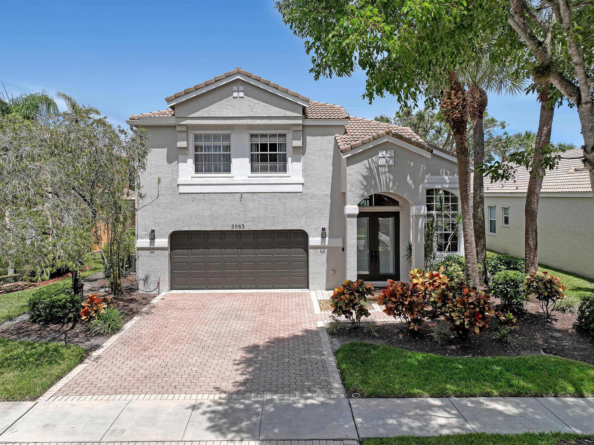Seasonal Rent! Welcome to your two-story, fully furnished, move-in ready freshly painted 4-bedroom, 3.1-bathroom single-family home with a 2-car garage, located in a gated community with serene water views and a recently refinished, heated, and screened-in pool. The first floor features a game room, sitting area, dining space, one bedroom, a full bathroom, and a renovated open kitchen with granite countertops, stainless steel appliances, and tile flooring throughout. Upstairs, the primary suite includes an office nook, a Jack-and-Jill bathroom with double vanities, bath tub and shared shower, and two spacious walk-in closets. Two additional guest bedrooms feature carpet flooring and share a full bathroom. WiFi, basic cable, pest control, lawn and pool services are included.