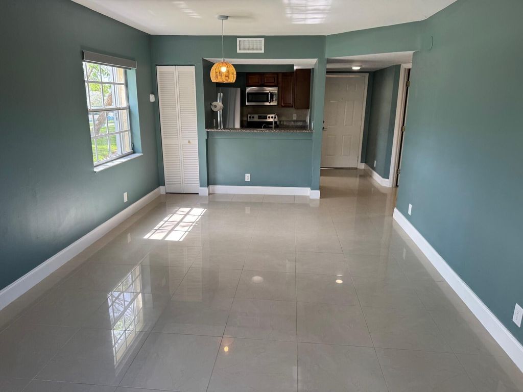 Photo of 1010 Lake Shore Drive #104, Lake Park, FL 33403 (MLS # R11063836)
