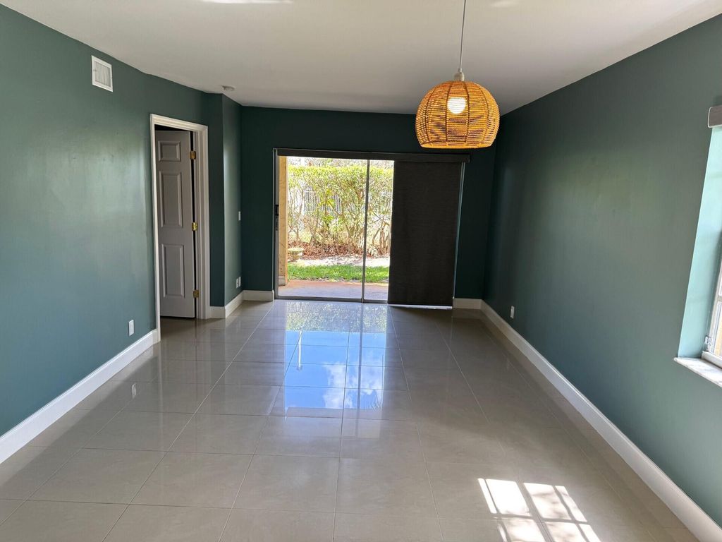 Photo of 1010 Lake Shore Drive #104, Lake Park, FL 33403 (MLS # R11063836)