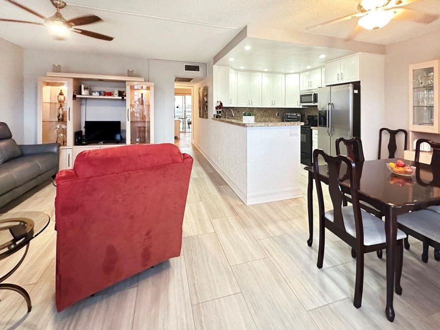 GORGEOUS OPEN KITCHEN, FANTASTIC LOCATION, 4TH FLOOR PENTHOUSE!! YOU WILL LOVE THIS UPDATED KITCHEN W/WHITE SHAKER CABINETS, GRANITE COUNTERS & BACKSPLASH, S.S. APPLIANCES & EXTRA STORAGE!! WOOD PLANK VINYL FLOORING THRU-OUT! NEW A/C & ELECTRICAL PANEL!! UPDATED PRIMARY BATH W/ BEAUTIFUL VANITY & TILED TUB/SHOWER! THE ENCLOSED PATIO LOOKS OUT OVER WHAT WILL SOON BE PHASE 2 OF CVE CENTRAL PARK!! TO TOP OF IT ALL OFF, YOU CAN WALK TO THE FABULOUS CENTURY VILLAGE CLUBHOUSE WHERE THERE ARE AMENITIES GALORE!! THEY INCLUDE A 1,500 SEAT THEATER, PREMIERE PERFORMANCES, A STATE OF THE ART GYM, TENNIS & PICKEBALL, HEATED INDOOR & OUTDOOR POOLS (15 IN ALL), CLASSES OF EVERY TYPE & MORE!! FREE TRANSPORTATION INSIDE & OUT, TOO!! CLOSE TO BEACH, SHOPPING, RESTAURANTS & MAJOR HWYS! ASSOC CLAIMS 55+