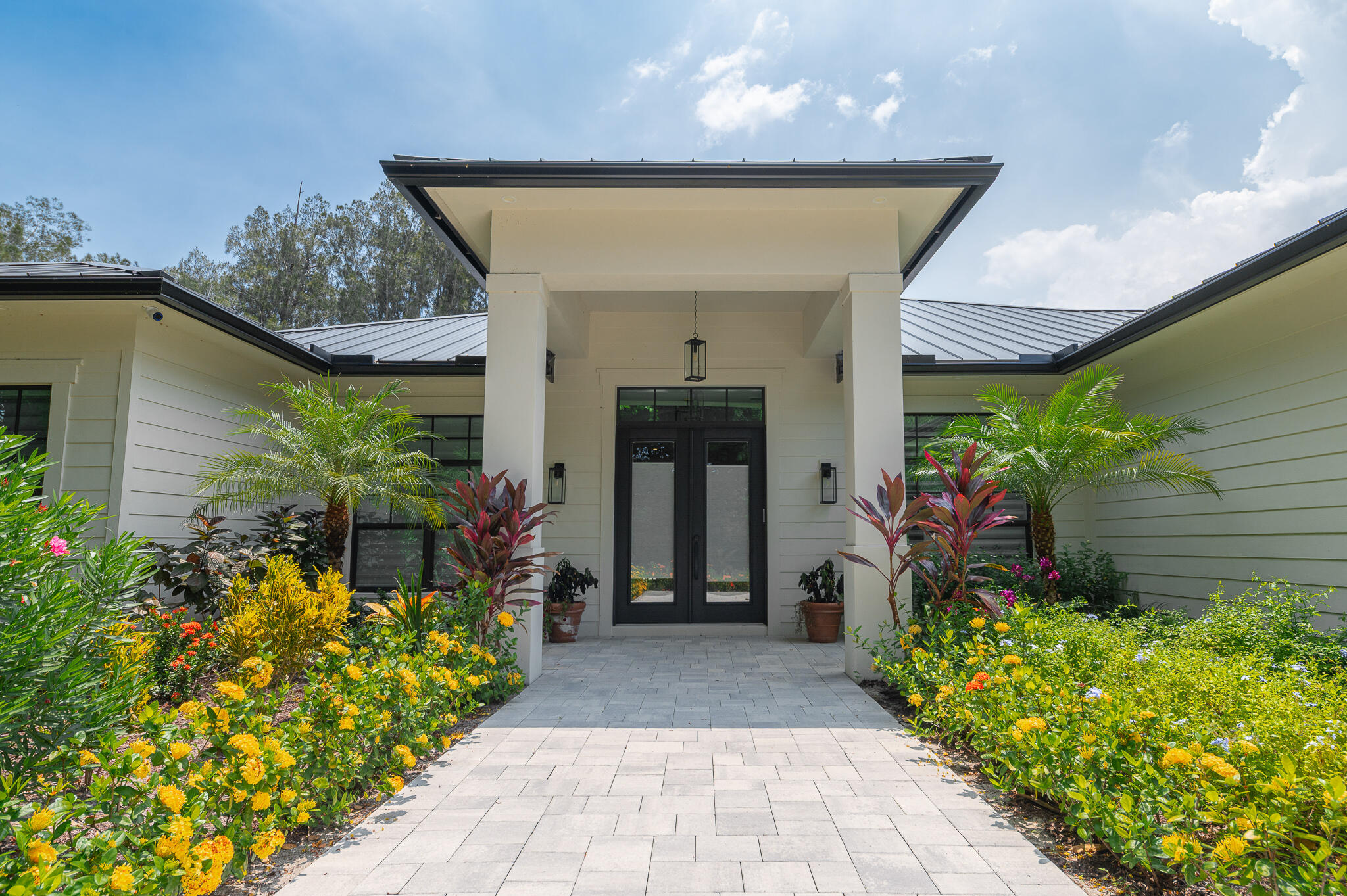 Nestled by the ''Banyan Tree Tunnel,'' this single-story masterpiece is tucked into lush Banyan Tree Estates.Newer construction 2023 home offers 3,252 sq ft under air on a .59-acre corner lot w/meticulous design.The split floor plan w/5 br's (or 4 br's plus an office) & 31/2 baths offers much privacy.The great room features soaring ceilings,massive impact glass sliders,& seamless indoor-outdoor connection.Chef's kitchen is anchored by a generous island,premium appliances & gas range,walk-in pantry,& opens to the dining and living spaces,ideal for entertaining.Retreat to the primary suite w/dual sinks,separate tub & shower,& walk-in closets.The private saltwater pool,covered patio,summer kitchen,& open patio spaces encourage relaxation and al fresco dining.Built w/high-end finishes like til