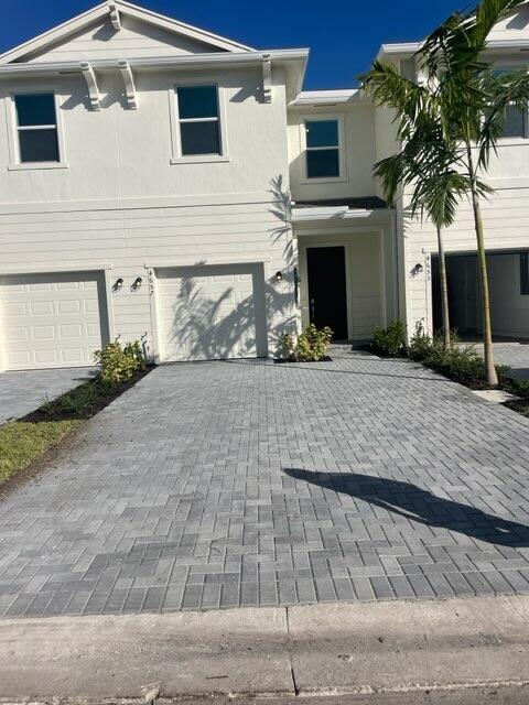 This two-story townhome showcases a contemporary open design among the first-floor kitchen, dining room and living room to promote seamless transitions between spaces. Through sliding glass doors is a terrace for outdoor relaxation. Upstairs caters to all three bedrooms, including the spacious owner's suite complemented by an adjoining bathroom and oversized walk-in closet.