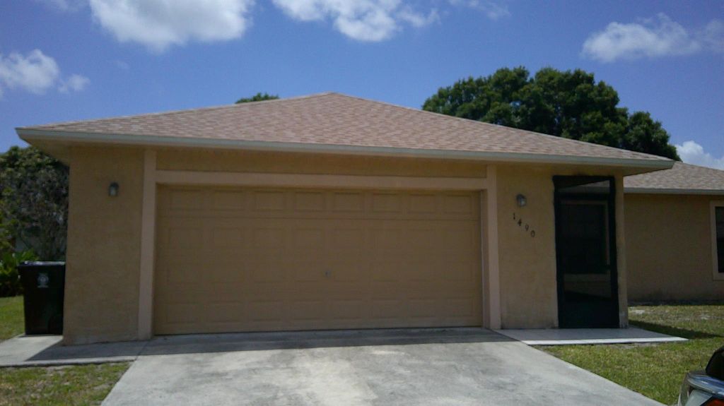 Photo of 1490 SE Grapeland Avenue, Port Saint Lucie, FL 34952 (MLS # R10990082)