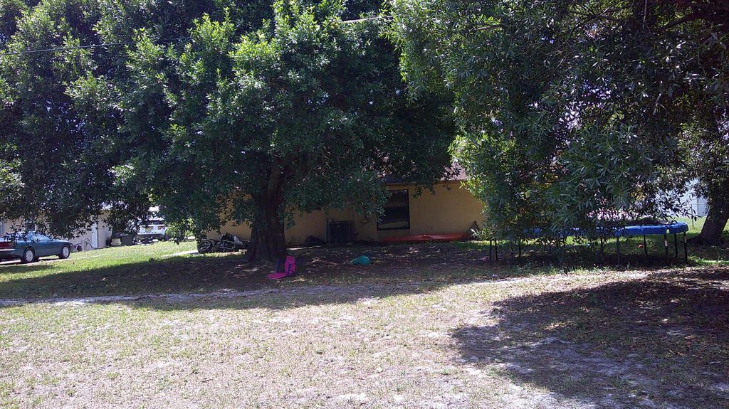 Photo of 1490 SE Grapeland Avenue, Port Saint Lucie, FL 34952 (MLS # R10990082)