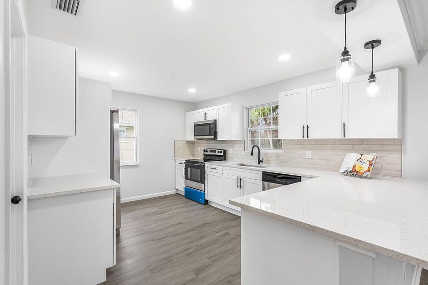 Prime Sebastian location. 1 mile to Riverview park, boat ramp, parks, shopping/dining. This perfectly updated home features 3 beds & 2 baths with a split floor plan. Updated kitchen with huge peninsula, quartz countertops, custom backsplash, crisp white cabinets, pantry, black fixtures & new stainless steel appliances. The primary has a custom remodeled bathroom, walk-in closet & tile shower. LVP flooring, fresh paint, baseboards & light fixtures w/ remote-controlled fans add a fresh touch throughout. Screened/covered patio, shed, gutters, new drain-field, 2021 roof, 2021 W/H, 2018 AC. NO HOA!