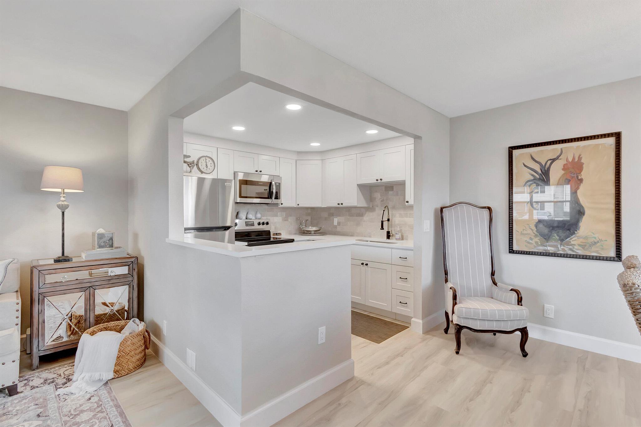 This move-in no-expense spared remodeled 1 bed 1 & a half bath Monaco J condo is the perfect fit for everyone. Ground floor unit features a custom kitchen with quartz counters, white shaker style soft close cabinets & stunning marble backsplash make this kitchen top of the line. Luxury vinyl floor planks throughout the living space,custom bathrooms, features a walk-in shower made to suit each room. Master bedroom has a direct access to the closed patio with water views. All appliances are new including a washer and dryer with storage closet on the covered patio with tranquil views. You'll love the amenities of Kings Point including two 18-hole golf courses designed by Robert Trent Jones,Sr.swim & tennis & exercise studio.