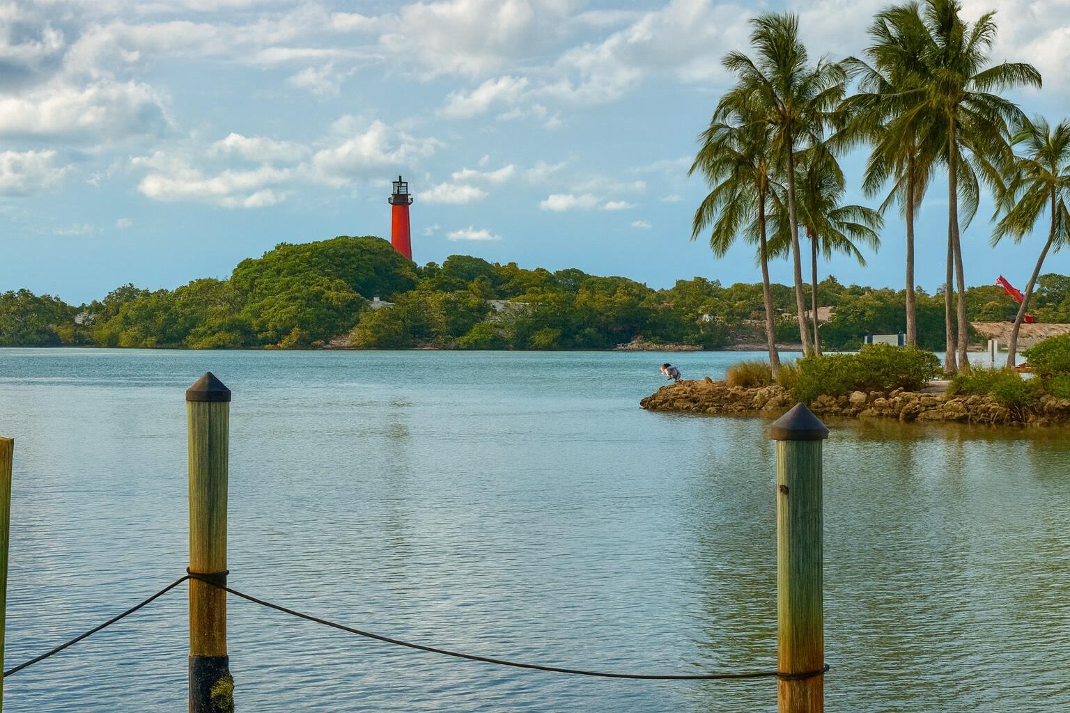 Wake up each day to spectacular panoramic views of the iconic Jupiter Lighthouse and Inlet from this fully renovated 2-bedroom plus den waterfront condo. Just steps from your door, you can walk to the ocean, stroll through Dubois Park, or dine at Guanabanas and six other gourmet restaurants, placing you in the heart of one of South Florida's most coveted coastal lifestyles.This residence offers 2,095 total square feet and one of the closest private docks to the ocean in all of Jupiter. The property has been transformed through a first-class, total renovation where no detail was overlooked.