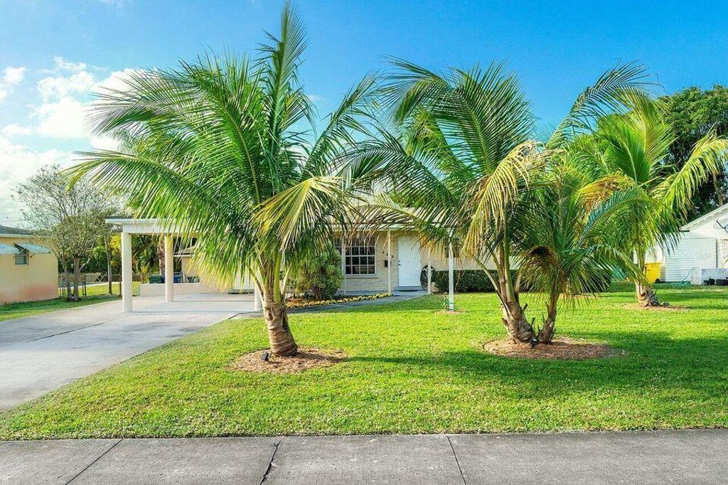 Photo of 323 Flagler Boulevard, Lake Park, FL 33403 (MLS # R10968737)