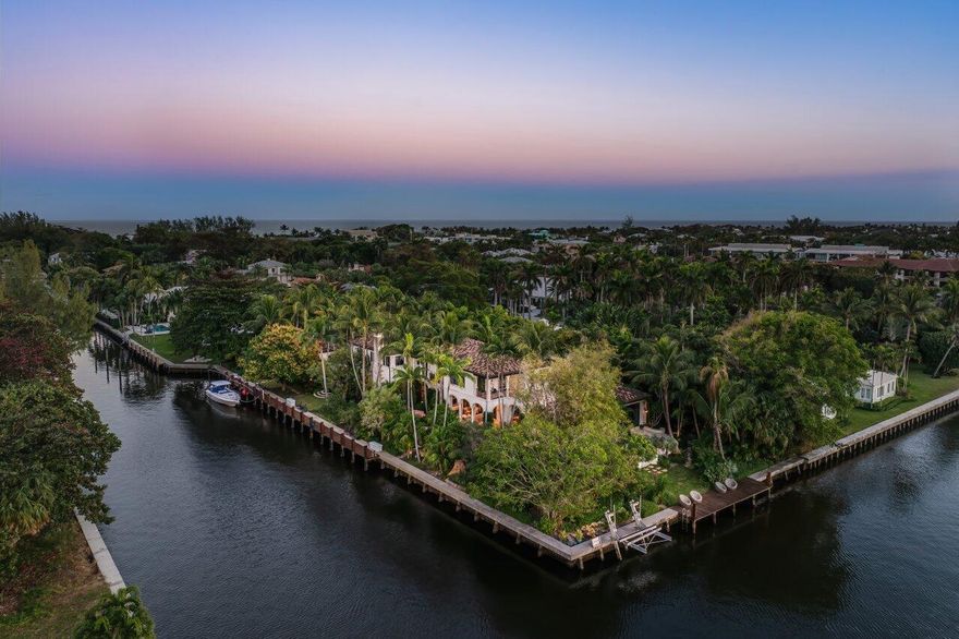 With an extraordinary point-lot position featuring 446'+/- of waterfront, 8 Driftwood Landing stands as one of Gulf Stream's most distinguished properties. Spanning 1.12 acres, this estate represents the pinnacle of coastal living, designed by the renowned Randall Stofft and impeccably finished by the acclaimed Marc Michaels Interiors. Every detail reflects a harmonious blend of refinement, sophistication, and comfort. This thoughtfully crafted residence offers 7,293 square feet under air, with a gracious layout designed to maximize panoramic water views and seamless indoor-outdoor living. The estate includes five en-suite bedrooms, two half bathrooms, and a private guest house complete with its own bedroom, bath, living area, and kitchen--perfect for hosting guests in style and privacy.