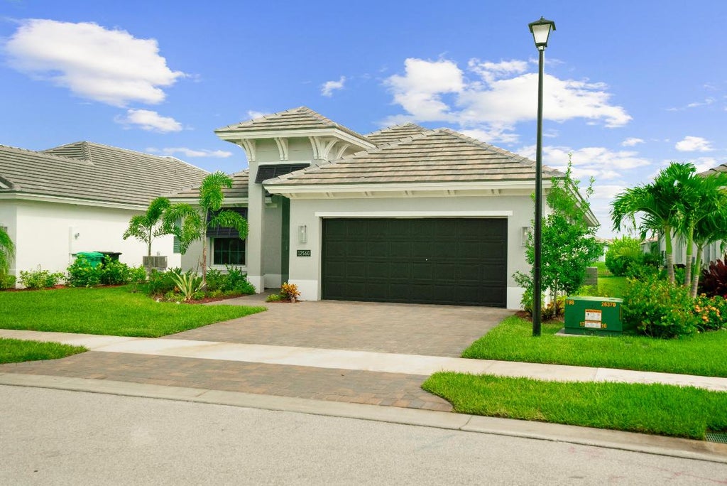 Photo of 12560 SW Sunrise Lake Terrace, Port Saint Lucie, FL 34987 (MLS # R10996737)