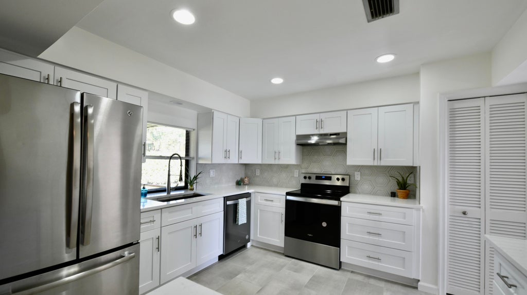 Photo of 57 Pinehill Trl W, Tequesta, FL 33469 (MLS # R10957115)