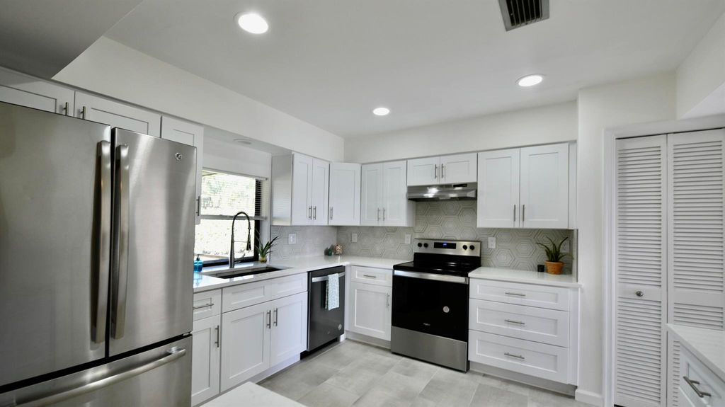 Photo of 57 Pinehill Trl W, Tequesta, FL 33469 (MLS # R10957115)