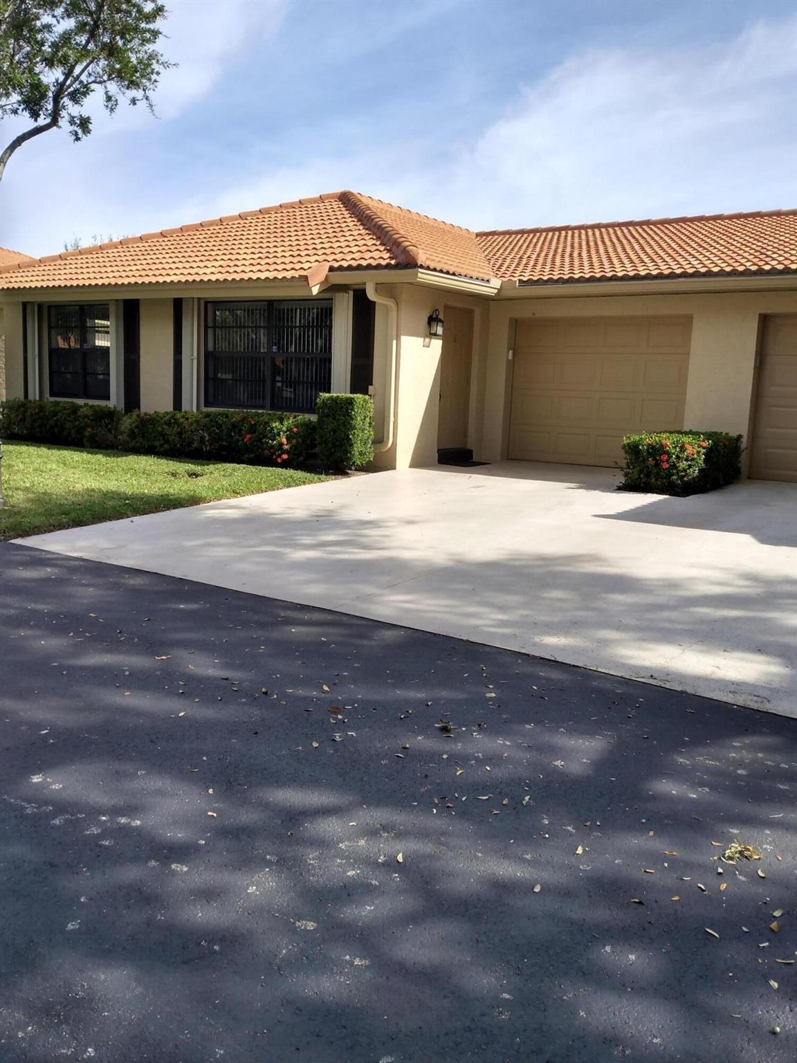 Light, Bright and Clean! No carpet: Tile and hardwood floors throughout. Quiet location in complex and easy in and out and short walk to clubhouse and pool. Clubhouse activities include Bingo, cards, pool parties and holiday/special event celebrations. Automatic gate in front for extra community safety and great location to all local shopping - and the Beach!!