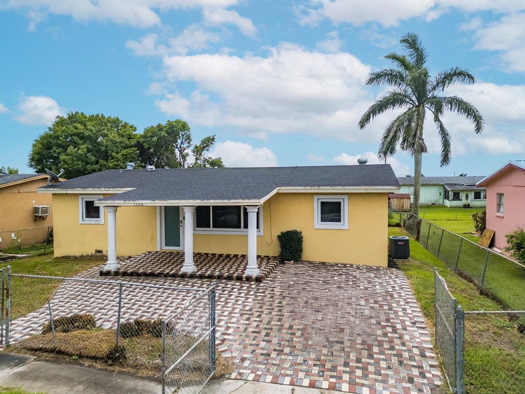 Photo of 1528 Singletary Avenue, Pahokee, FL 33476 (MLS # R11095936)