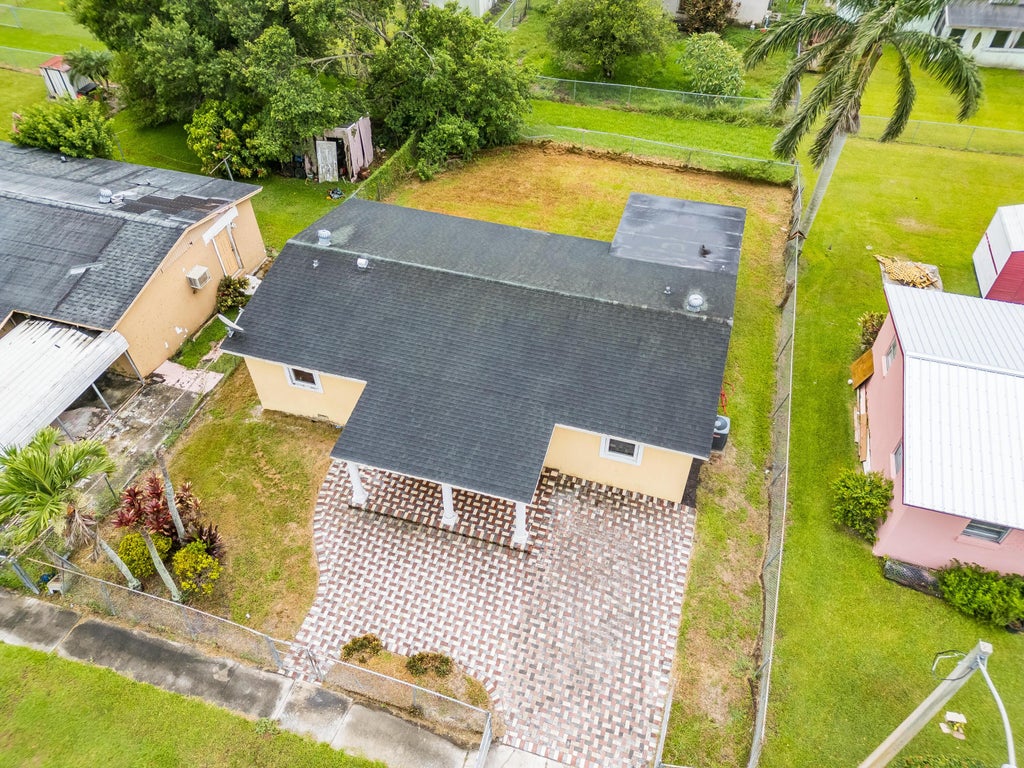 Photo of 1528 Singletary Avenue, Pahokee, FL 33476 (MLS # R11095936)