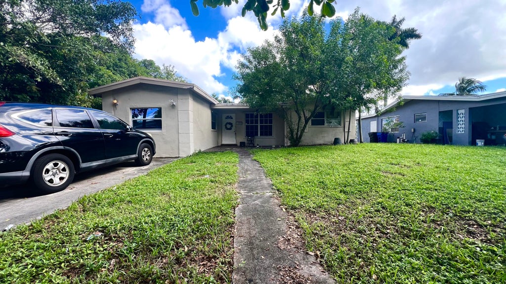 Photo of 3999 NW 36TH Street, Lauderdale Lakes, FL 33309 (MLS # B26082302)
