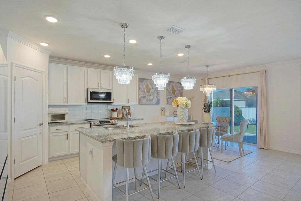 Photo of 3498 SW Ronald Street, Port Saint Lucie, FL 34953 (MLS # R10931966)