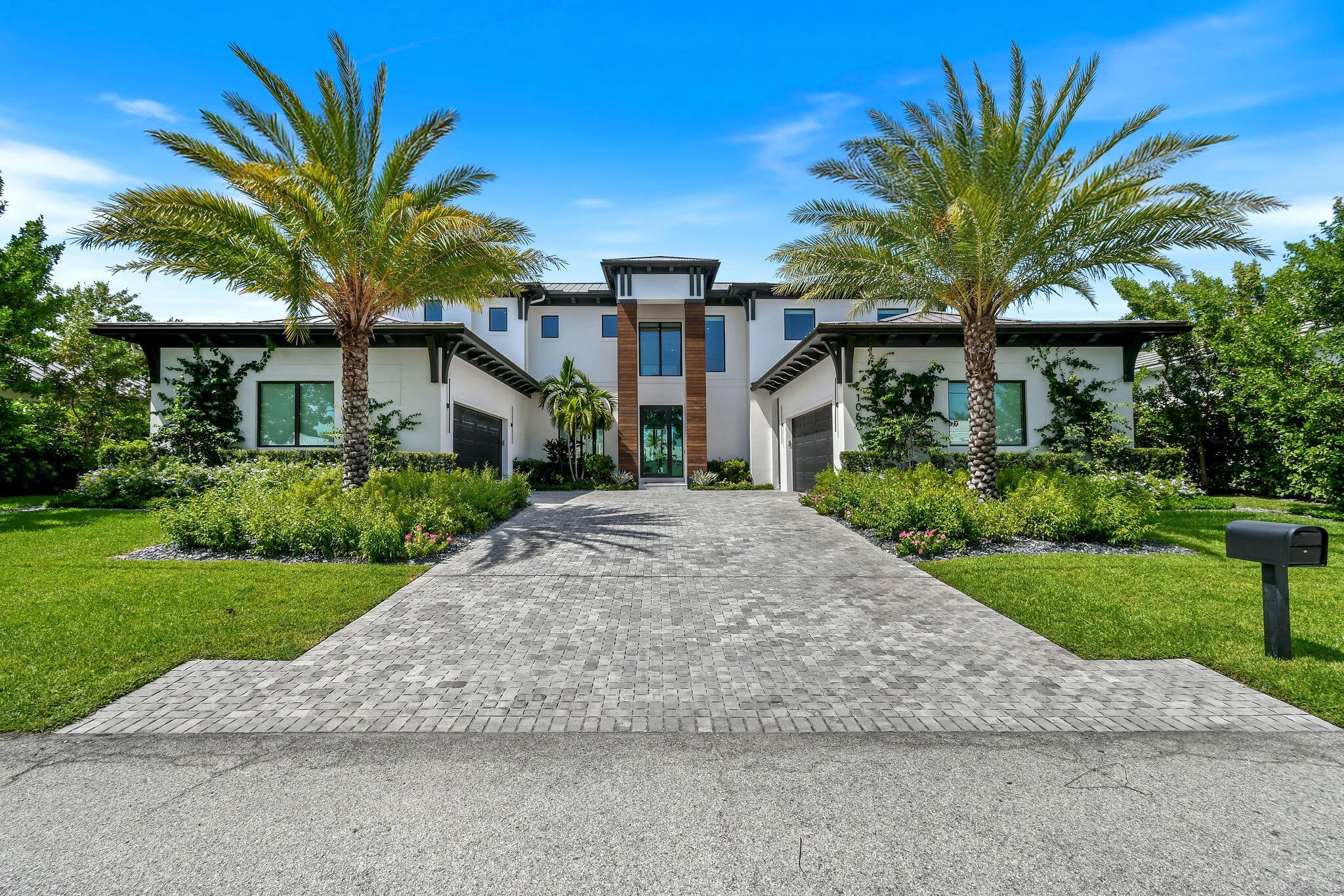 Experience the ultimate in coastal living with this custom-built residence, perfectly situated on a deep-water canal with 100 feet of waterfront and direct ocean access. Located in the prestigious Palm Beach Isles community on Singer Island, this home is surrounded by exceptional properties and just moments from pristine beaches, fine dining, and luxury spas. Designed for boaters and entertainers alike, 1060 Fairview Lane features a brand-new dock, new 40,000 lb boat lift, an ultra-sleek Euro-edge pool and spa, and an expansive covered patio with a full summer kitchen. The generous floor plan spans over 6,500 square feet of living space and offers 5 bedrooms, including upper and lower primary suite options, plus 7 full baths, a 6th bedroom/club room, and a private study. Whole house water