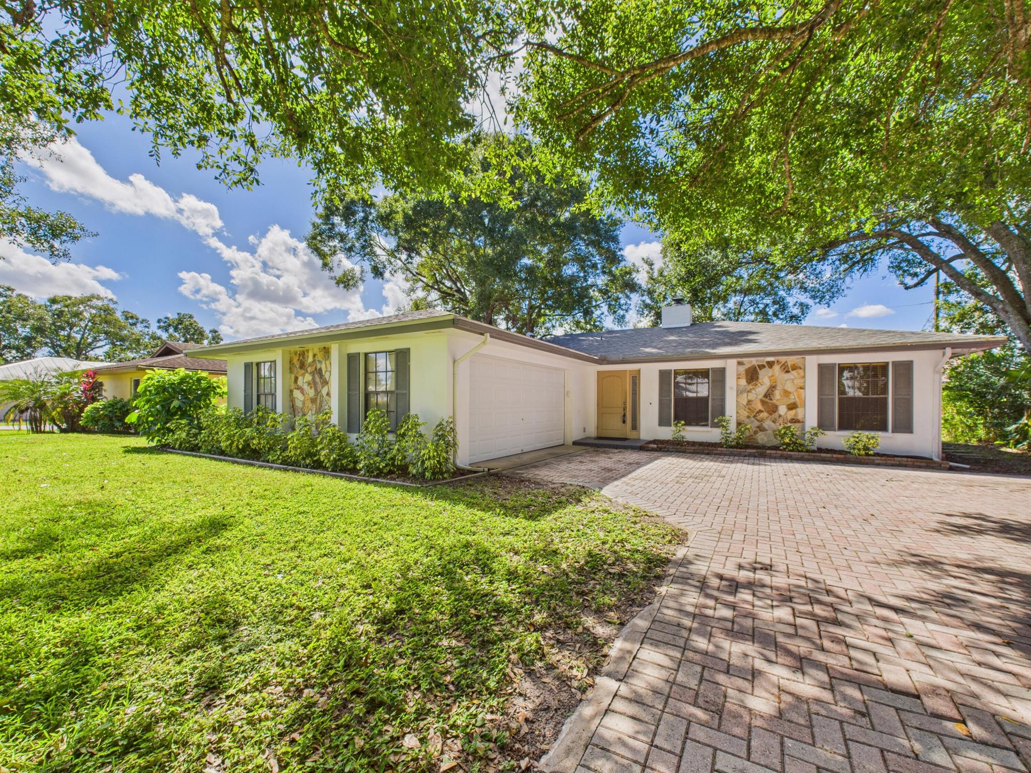 Pet- friendly charming 3-bedroom, 2-bath home in north-central Vero Beach! Enjoy easy-care tile floors throughout, a screened porch overlooking a private backyard, and a garage with built-in workbenches. Nestled in a beautiful, mature neighborhood with shady trees, this home offers comfort, convenience, and a pet-friendly setting close to shopping, dining, and beaches. No hoa