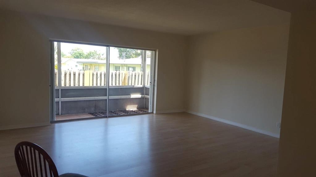 Just renovated and not lived in since renovations! This spacious ground floor condo features brand new laminate flooring throughout, brand new kitchen appliances and fresh paint. Basic cable, water/sewer/trash are included! Community includes a pool, reserved parking and laundry room located adjacent to the unit. Located just around the corner from Palm Beach Gardens Rec Center and City Hall. Walk to the Green Market every Sunday! Sorry no pets allowed.
