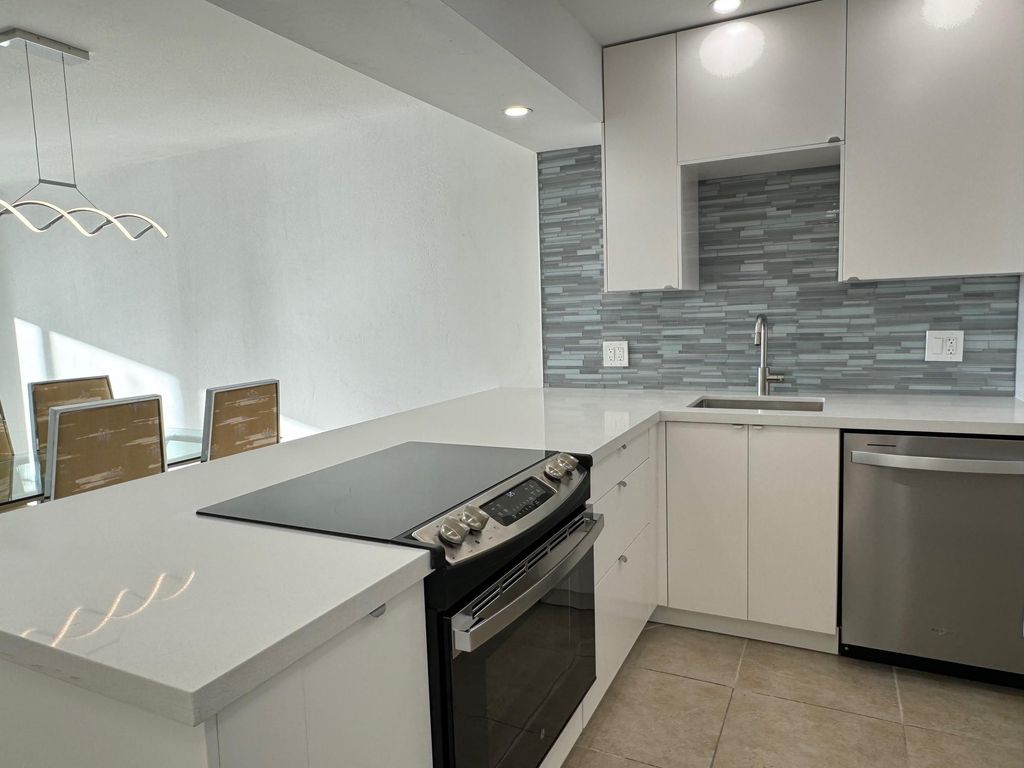 Photo of 3095 N Course Drive, Pompano Beach, FL 33069 (MLS # B26026886)