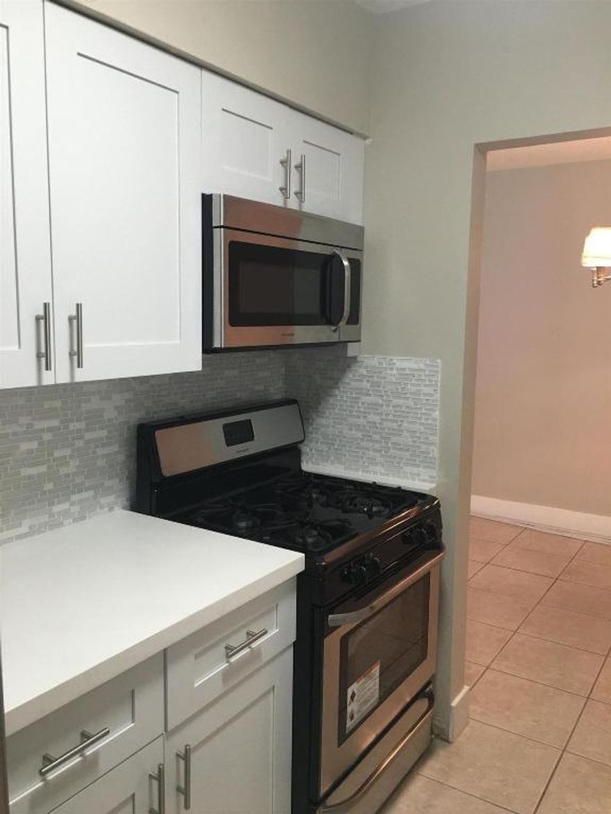 Remodeled 3 Bedroom, Granite and Stainless Steel Appliances. Tile and Laminate Floors