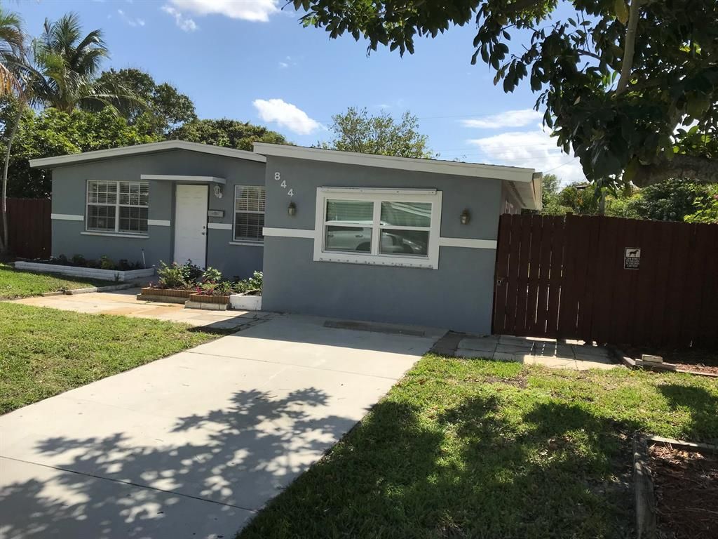 Photo of 844 Evergreen Drive, Lake Park, FL 33403 (MLS # R10873774)
