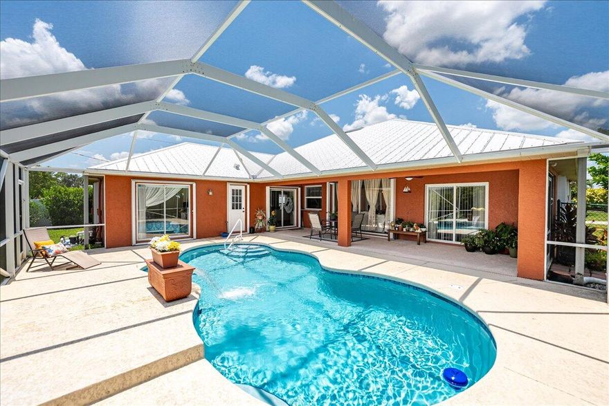 Beautiful 3BR+Den, 2BA pool home on an oversized corner lot just minutes from Tradition, with NO HOA! Features include updated kitchen with 42' cabinetry with crown molding, soft-close cabinets, granite counters, newer stainless-steel appliances, wood-look tile throughout, large laundry room, oversized pantry and separate living/dining areas. The Den is perfect for a home office or can be a 4th bedroom. Cabana bath opens to a beautiful, newly resurfaced screened pool with water feature and newer pool pump. Large covered Lanai, fenced yard with lush landscaping and 2019 metal roof, 2022 accordion shutters, and built-in sound system makes this home perfect for Florida living. Prime location near shopping, dining, and entertainment! Don't miss the opportunity to own this move-in ready home.