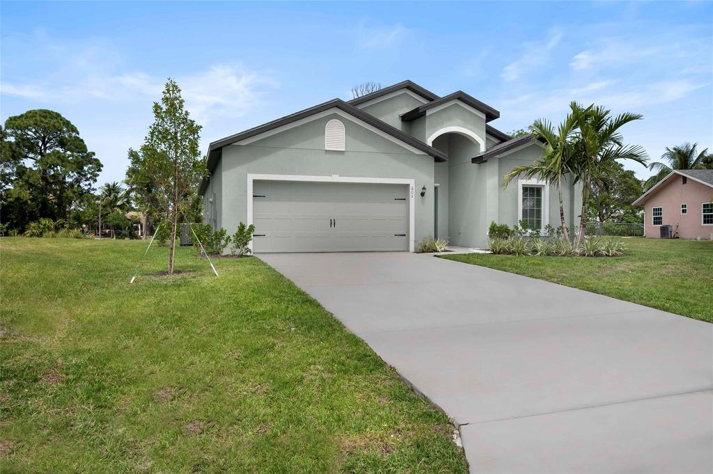 Photo of 605 SE Delancey Lane, Port Saint Lucie, FL 34984 (MLS # F10443178)