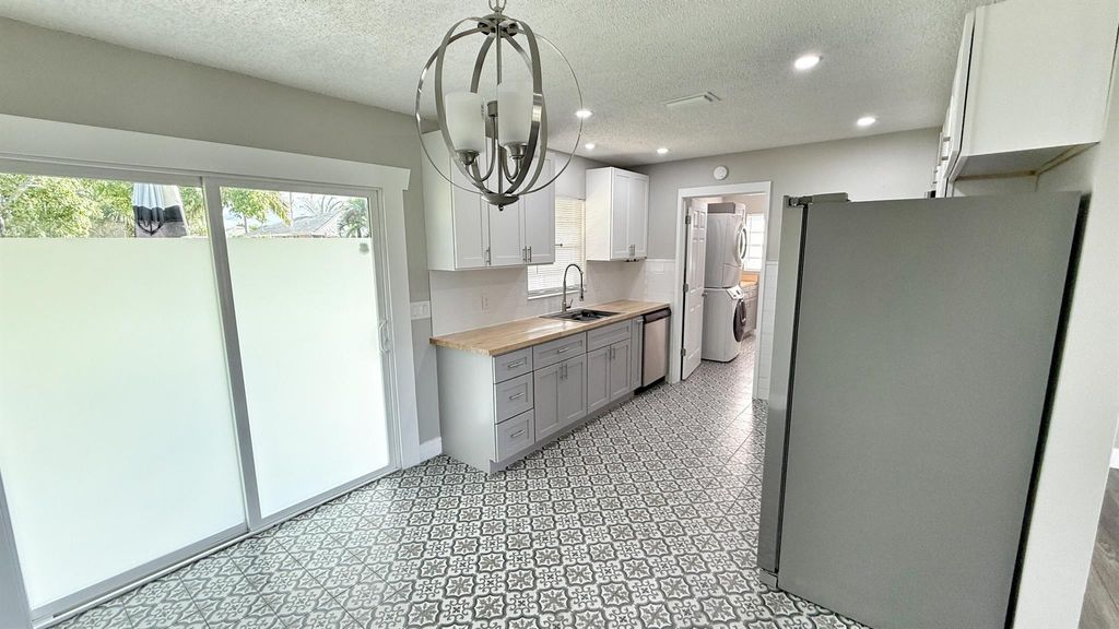 Photo of 542 SW Duxbury Avenue, Port Saint Lucie, FL 34983 (MLS # R11102942)