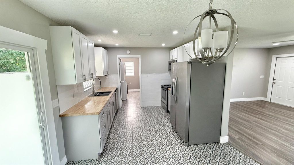 Photo of 542 SW Duxbury Avenue, Port Saint Lucie, FL 34983 (MLS # R11102942)